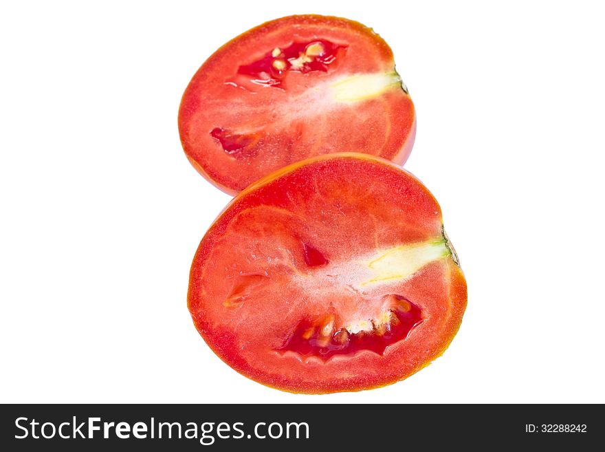 Cut of juicy tomato on a white background