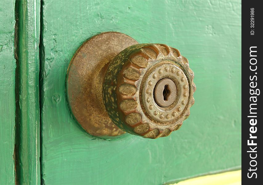 Vintage door knob on old wooden door