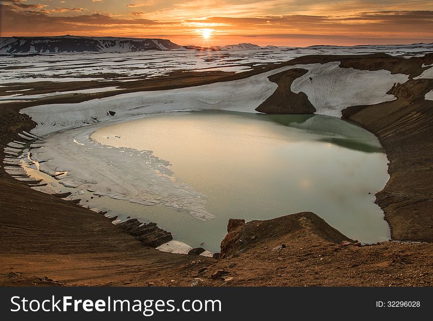 Midnight sunset over Viti crater in Krafla volcanic area, Iceland. Midnight sunset over Viti crater in Krafla volcanic area, Iceland.