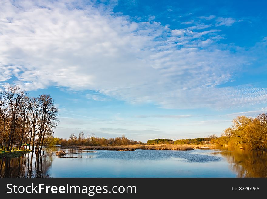 Sky And Clouds Reflection On Lake