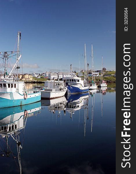 Boats moored at a wharf. Boats moored at a wharf.