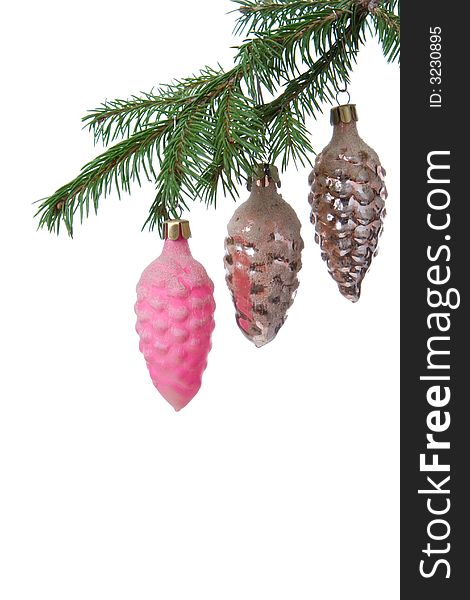 Christmas tree decoration cone and fir branch over white background