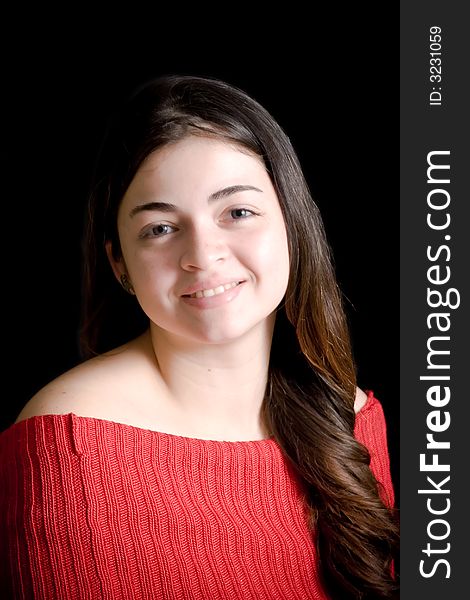 Portrait of beautiful hispanic woman with long hair, over black