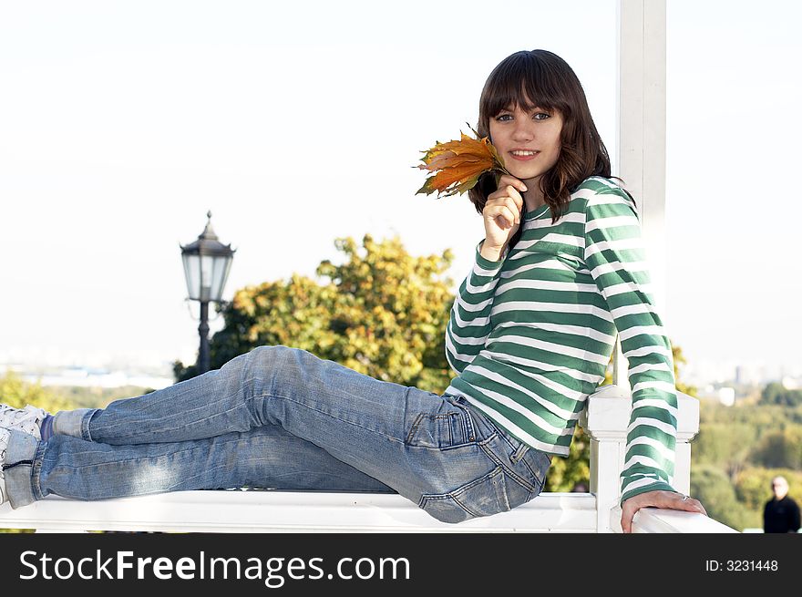 Girl holds autumn tree leafs. Girl holds autumn tree leafs