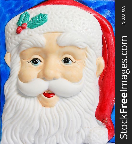 A painted pottery model Santa Claus face. A painted pottery model Santa Claus face