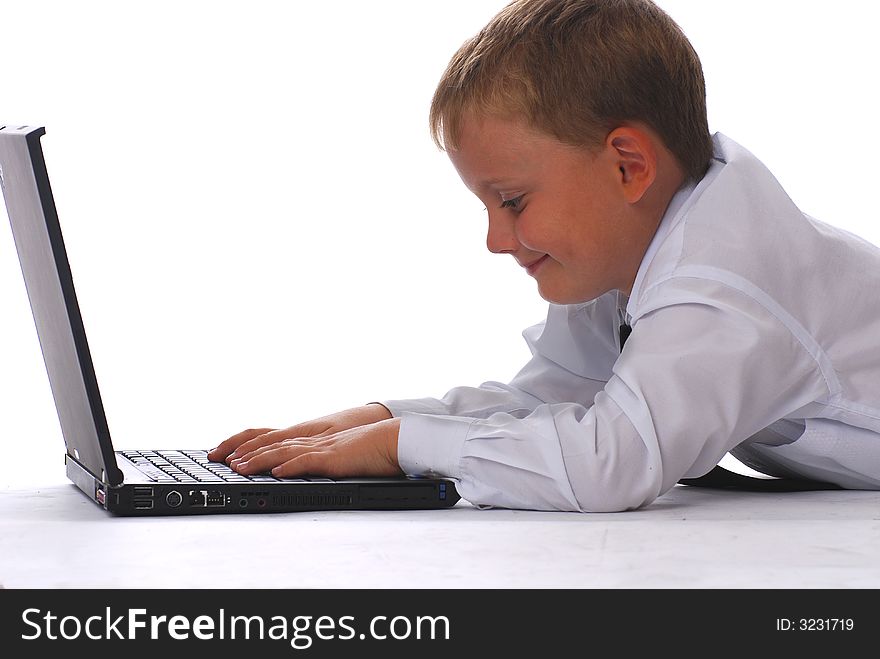 A boy with laptop isolated on white