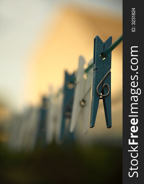 Clothes pegs on a clothes line . (Shallow DOF)