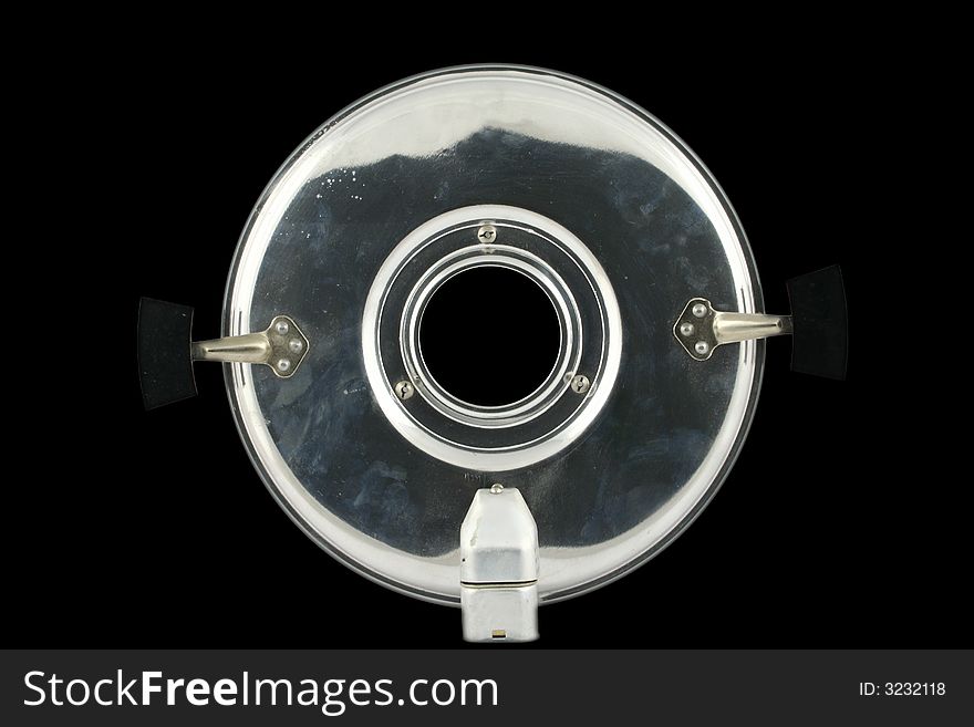 Abstract view at aluminum cover with black window in the middle of it on a black background. Abstract view at aluminum cover with black window in the middle of it on a black background