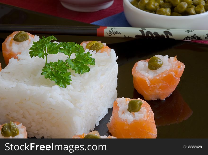 Sushi salmon rolls with boiled rice and caper. Sushi salmon rolls with boiled rice and caper