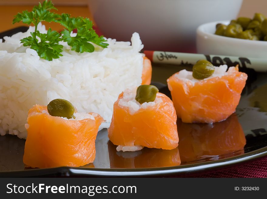 Sushi salmon rolls with boiled rice and caper. Sushi salmon rolls with boiled rice and caper
