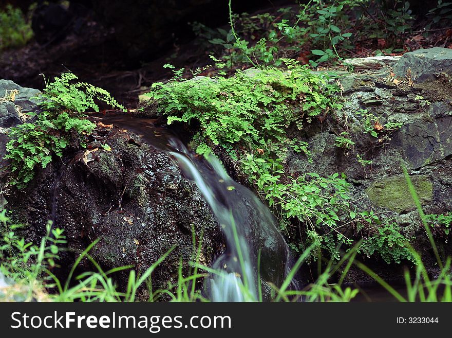 Small waterfall in the fountains of Amir-Ali near the village of Milopotamos in Kythera, Greece. Small waterfall in the fountains of Amir-Ali near the village of Milopotamos in Kythera, Greece