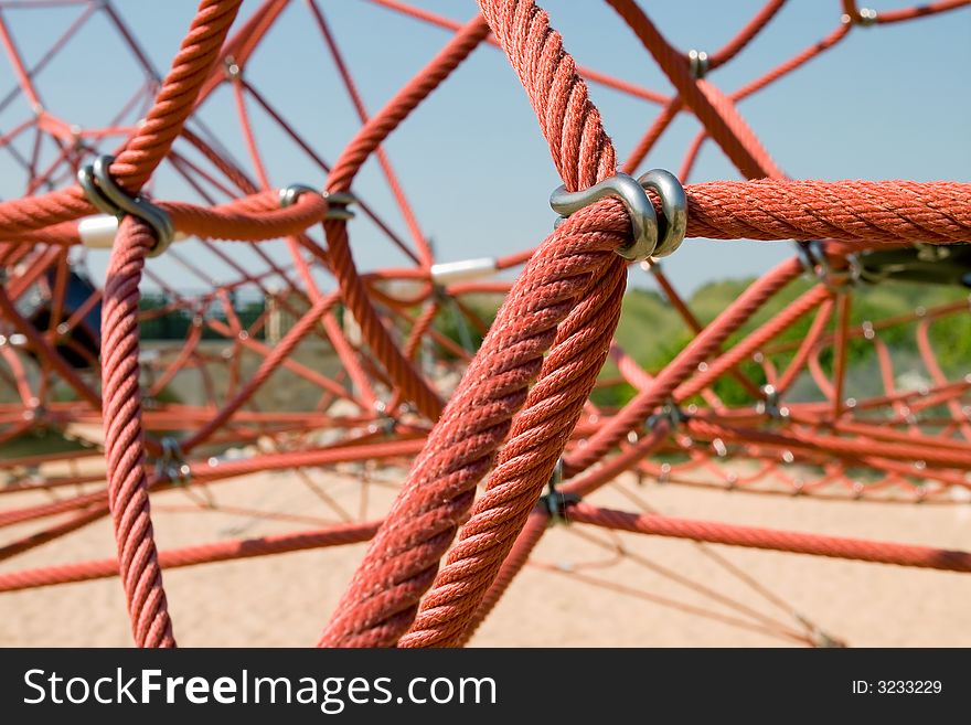 The red rope of climbing equipment in a children's playground