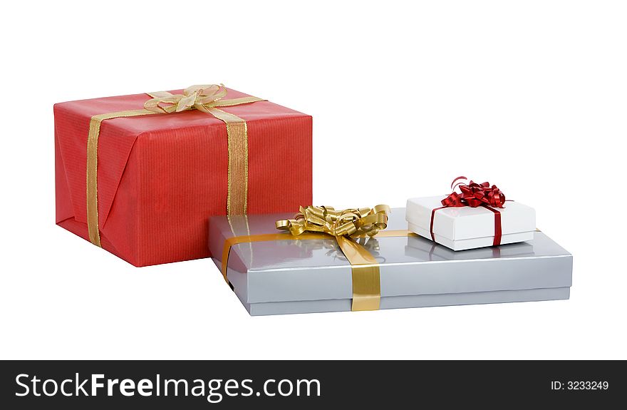 Several well-wrapped christmas gifts deep-etched on a white background. Several well-wrapped christmas gifts deep-etched on a white background
