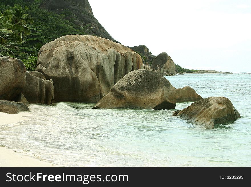 Several huge volcanic stones in the tropical ocean. Several huge volcanic stones in the tropical ocean