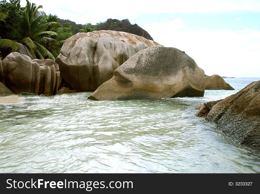 Huge volcanic stones staying in the ocean. Huge volcanic stones staying in the ocean