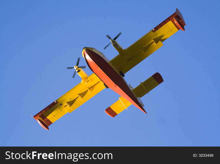 Firefighting plane above isolated on sky