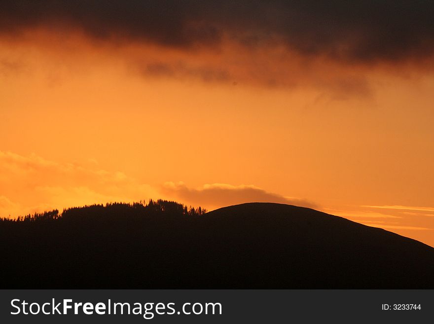 Dramatic orange sunrise over Cooley Mountains, Ireland. Dramatic orange sunrise over Cooley Mountains, Ireland.
