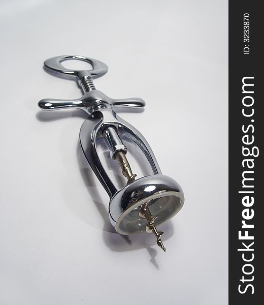 Kitchen attributes: a chromeplated metal corkscrew