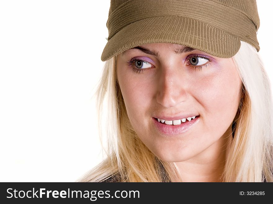 Blond woman wearing a hat looking to the side.