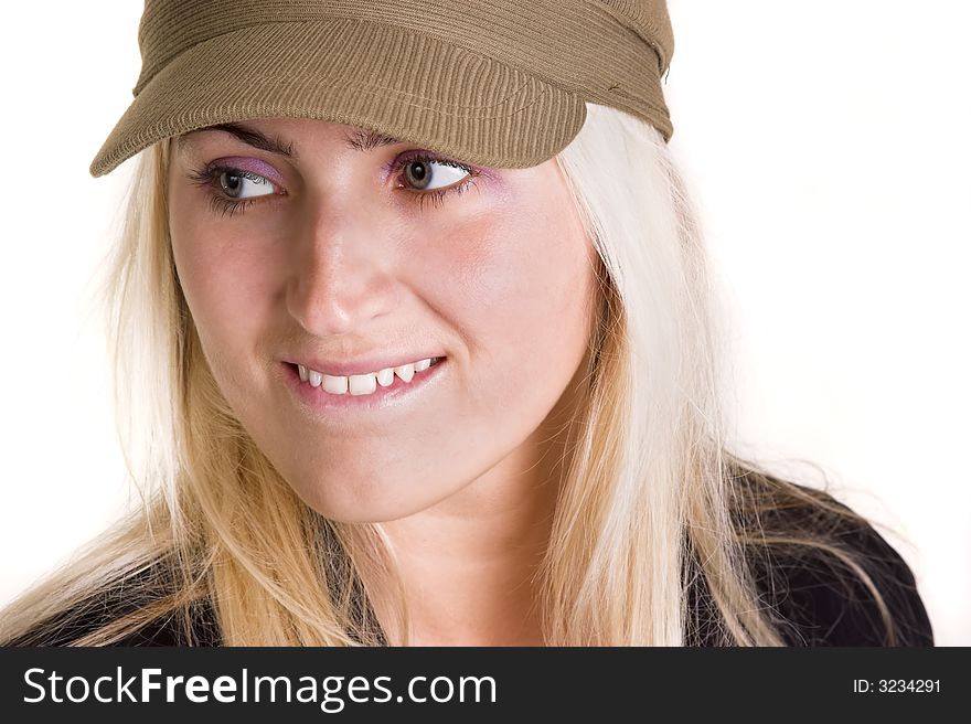 Blond woman wearing a hat looking to the side.