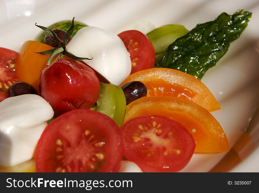 Buffalo mozzarella with four colors of tomatoes