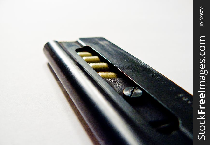 A closeup picture of a small handgun clip. A closeup picture of a small handgun clip