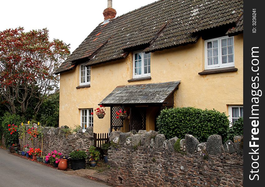 Quaint Thatched Cottage and garden in a Rural English Village. Quaint Thatched Cottage and garden in a Rural English Village