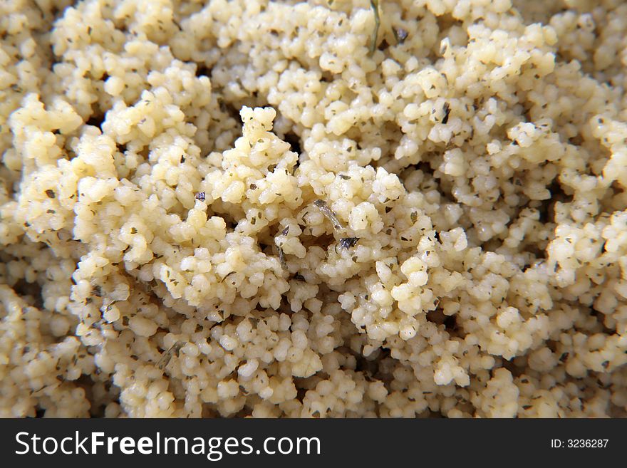 A bowl of flavored spiced cous cous as dinner carbohydrate