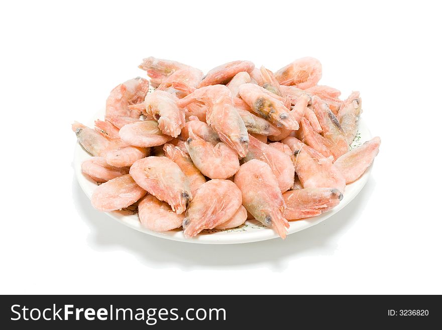 Frozen shrimps in the plate on the isolated background