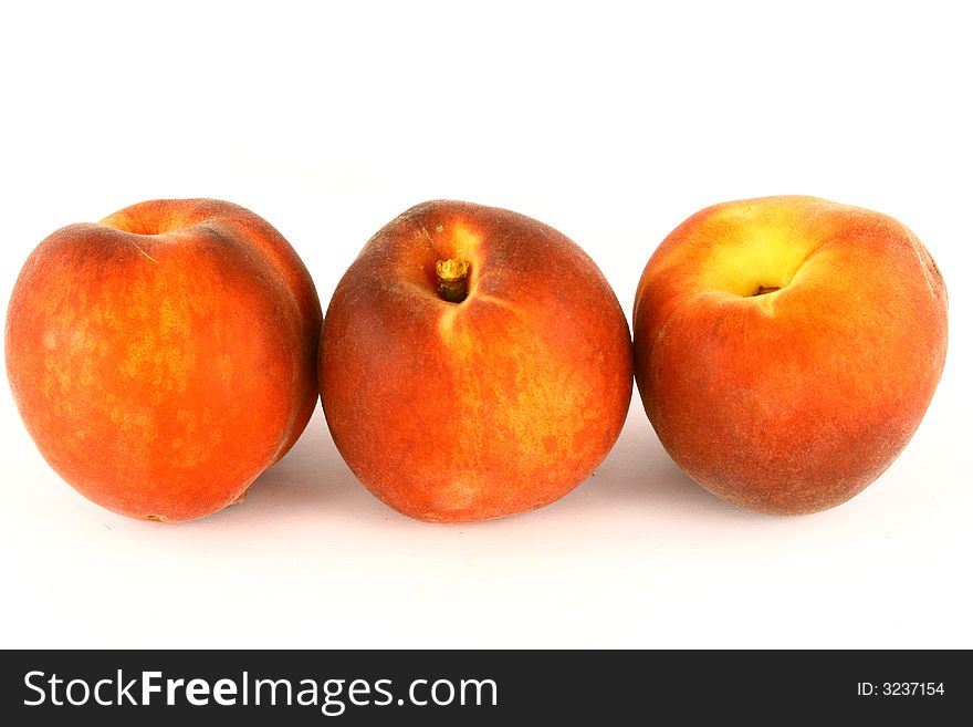 Ripe Peach with Leaf on White Background