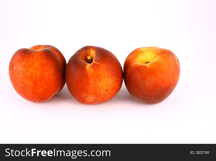 Ripe Peach with Leaf on White Background