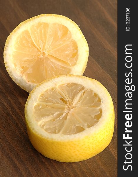 Lemon cut with backgroud of wood. Lemon cut with backgroud of wood