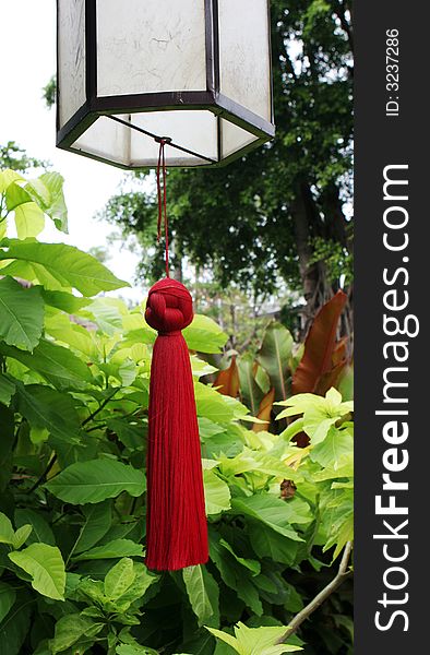 Asian hanging lantern with red tassel.