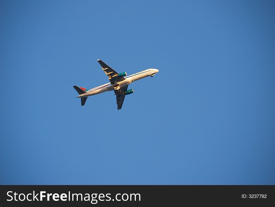 Underside of an airplane flying above