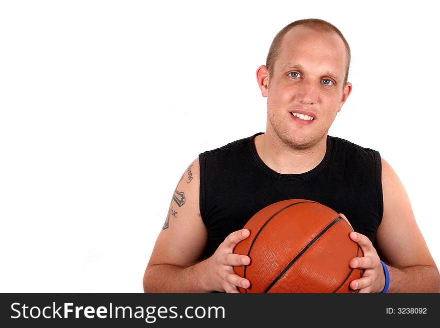 A young man with bright blue eyes and a basketball smiling! Isolated over white!. A young man with bright blue eyes and a basketball smiling! Isolated over white!