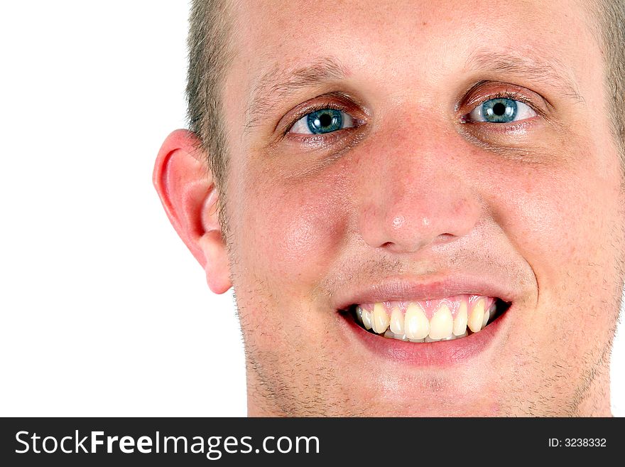 A studio portrait of a young man smiling with blue eyes! Isolated over white!. A studio portrait of a young man smiling with blue eyes! Isolated over white!