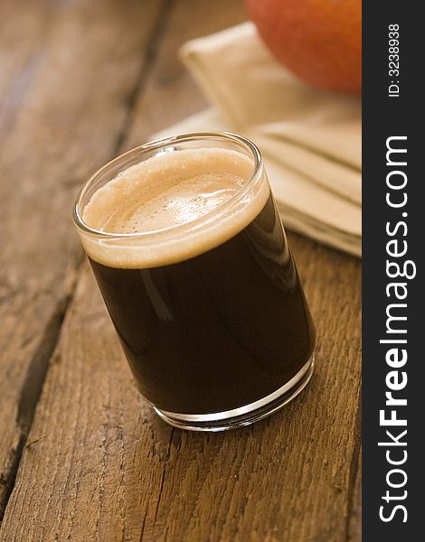 Glass of dark coffee with crema. Glass of dark coffee with crema