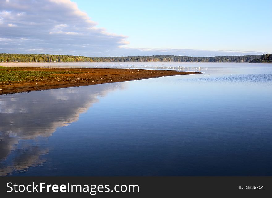 Sunrise sky  reflection in a pond