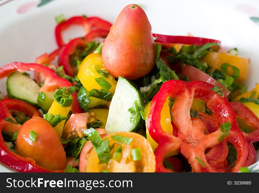 Colorful image of tasty fresh salad with tomatoes and cucumbers