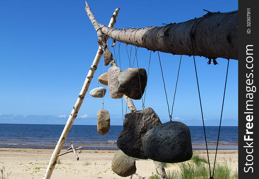 Modern construction on the Baltic Sea. The symbols on the stones speak of pagan traditions. Modern construction on the Baltic Sea. The symbols on the stones speak of pagan traditions.