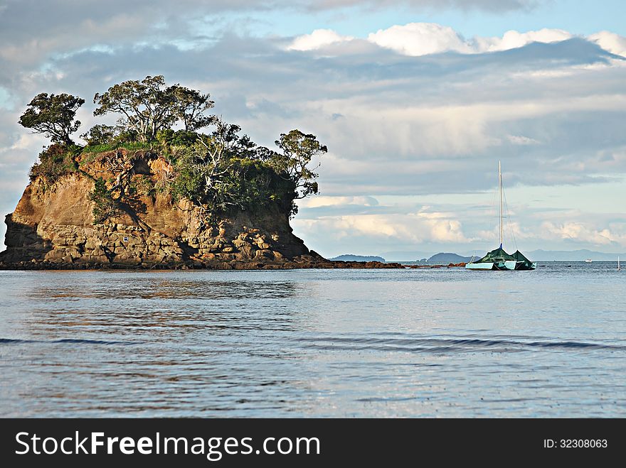 New Zealand, North Shore Torbay yacht anchored close to island at low tide. New Zealand, North Shore Torbay yacht anchored close to island at low tide