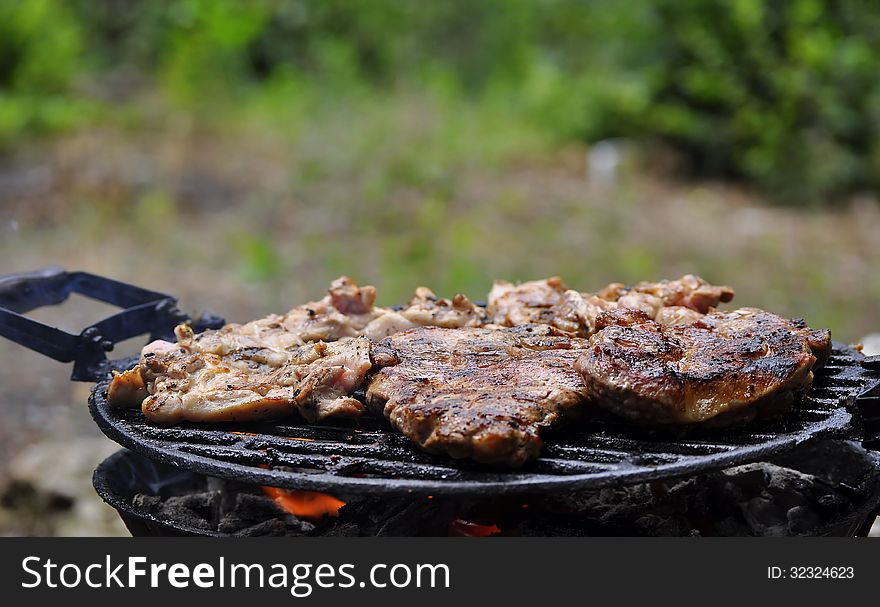 Steak grilled to nature during the day. Steak grilled to nature during the day