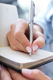 Woman Taking Notes At Home Stock Image