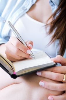 Woman Taking Notes At Home Stock Image