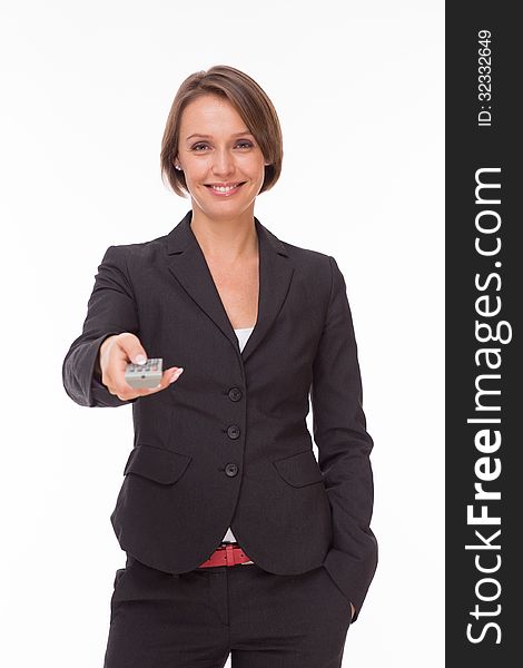 Businesswoman With Remote Control On White