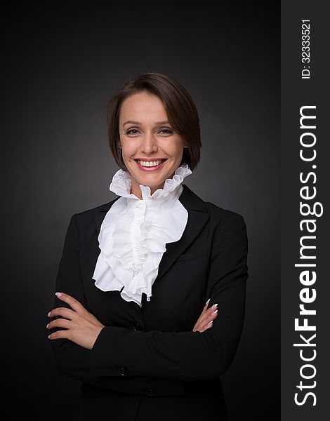 Beautiful business woman on dark grey background