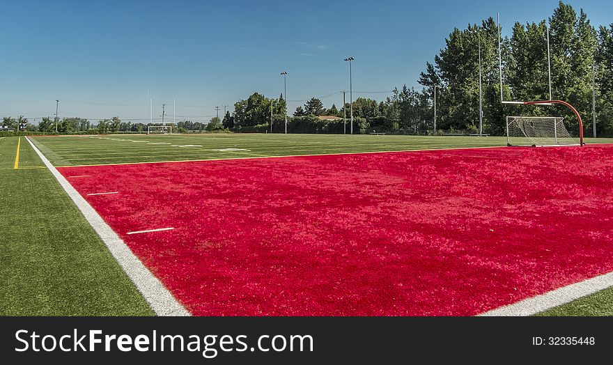 Football field on a sunny morning with blue sky