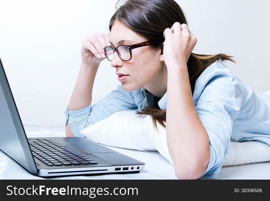 Young Woman Using Her Laptop At Home