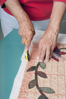 Cutting Edge Of Quilt Fabric. Stock Images