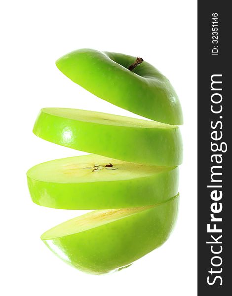 Green apple sliced into four pieces. Green apple sliced into four pieces